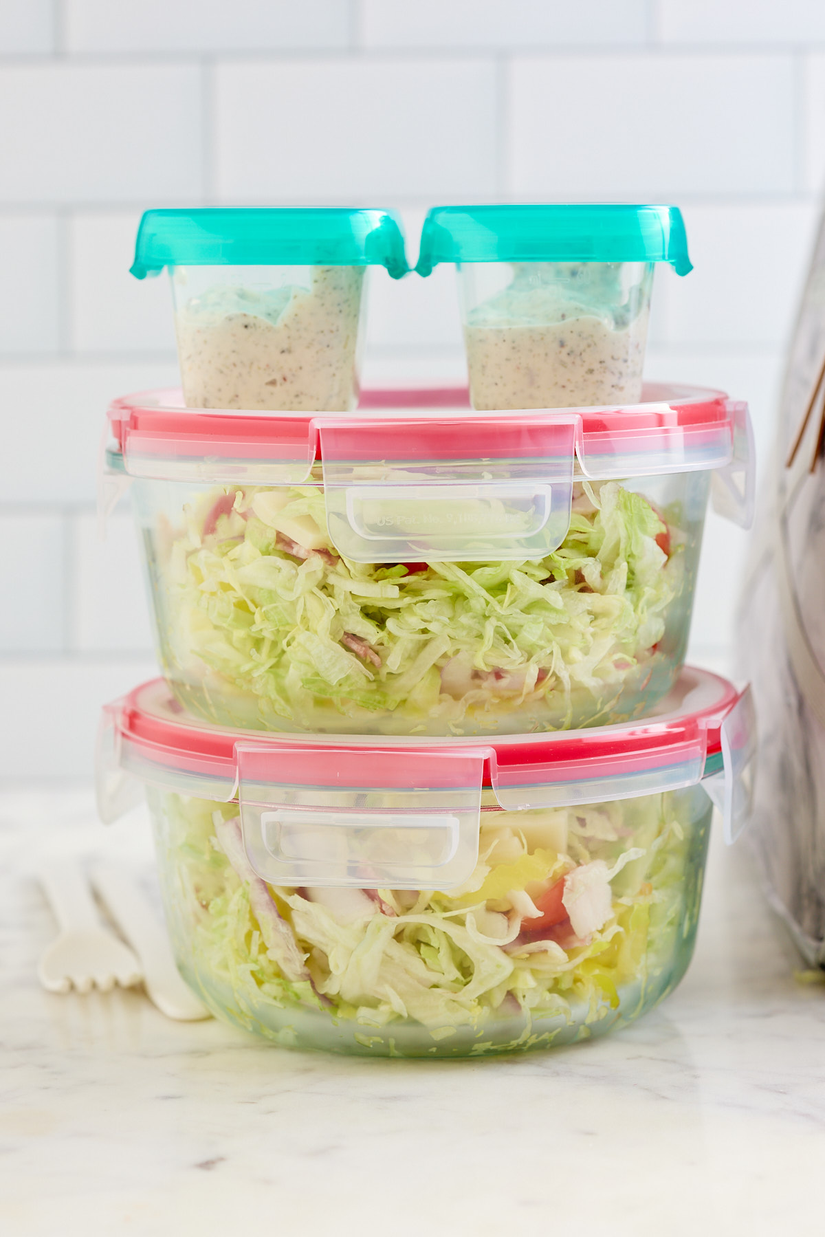 grinder salad packed containers stacked on top of each other 