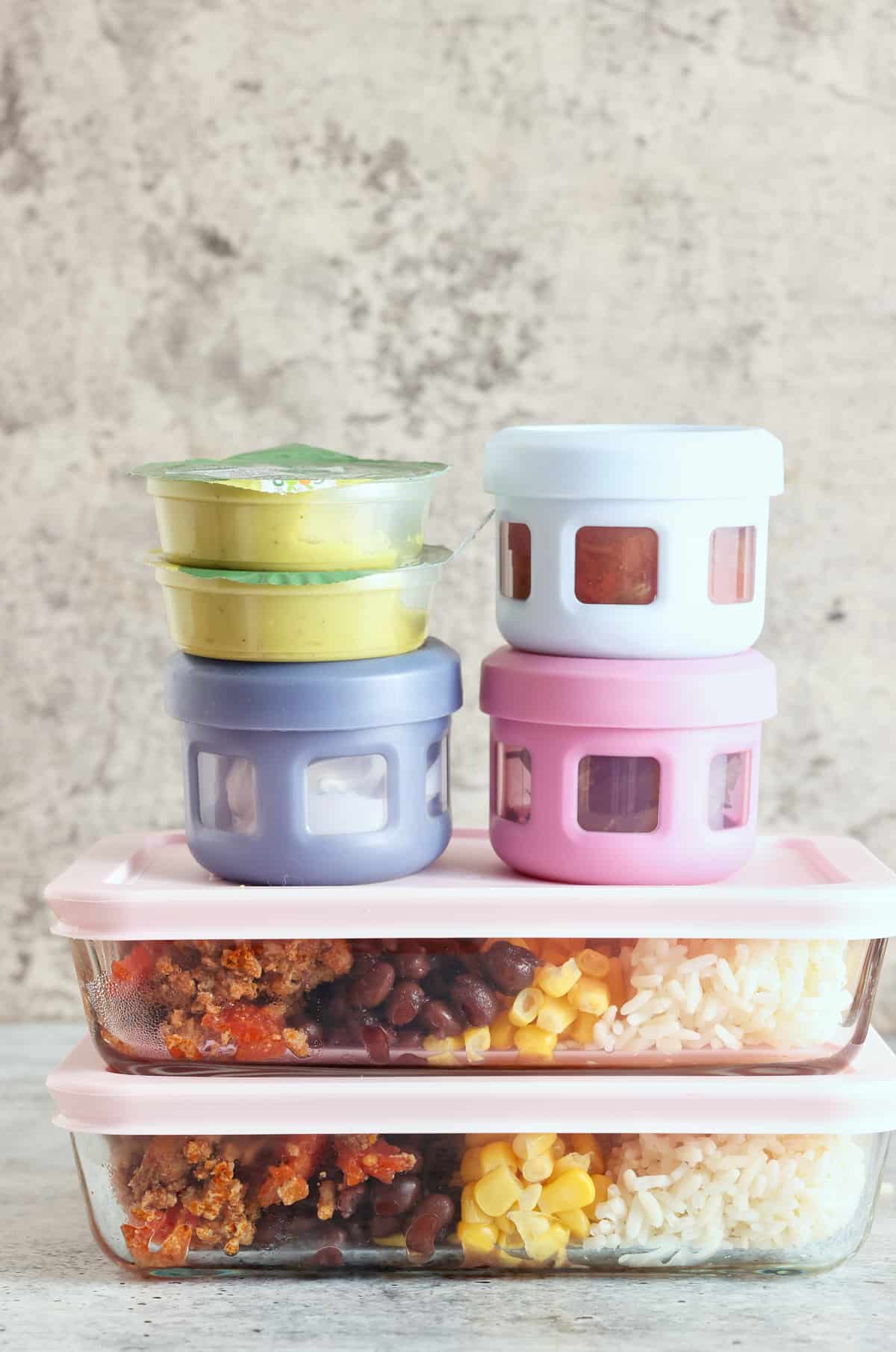 cooked food in colorful containers